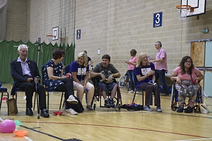 A group of people playing boccia